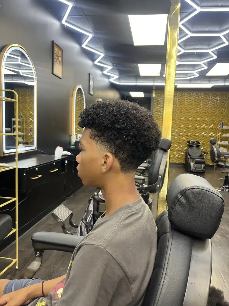 A curly top with a taper, side view