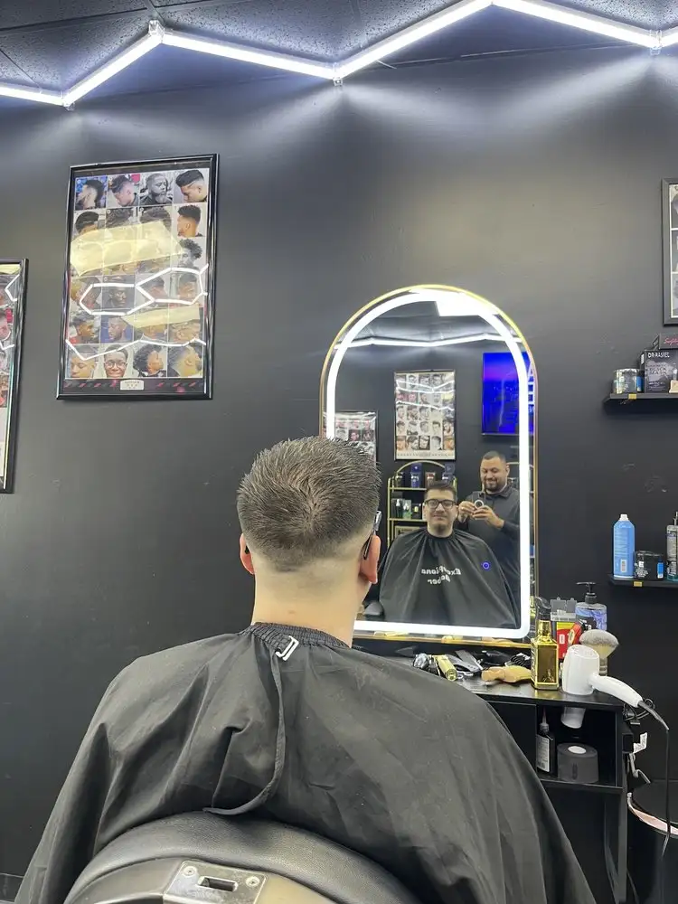 A fresh taper, seen from behind in the mirror