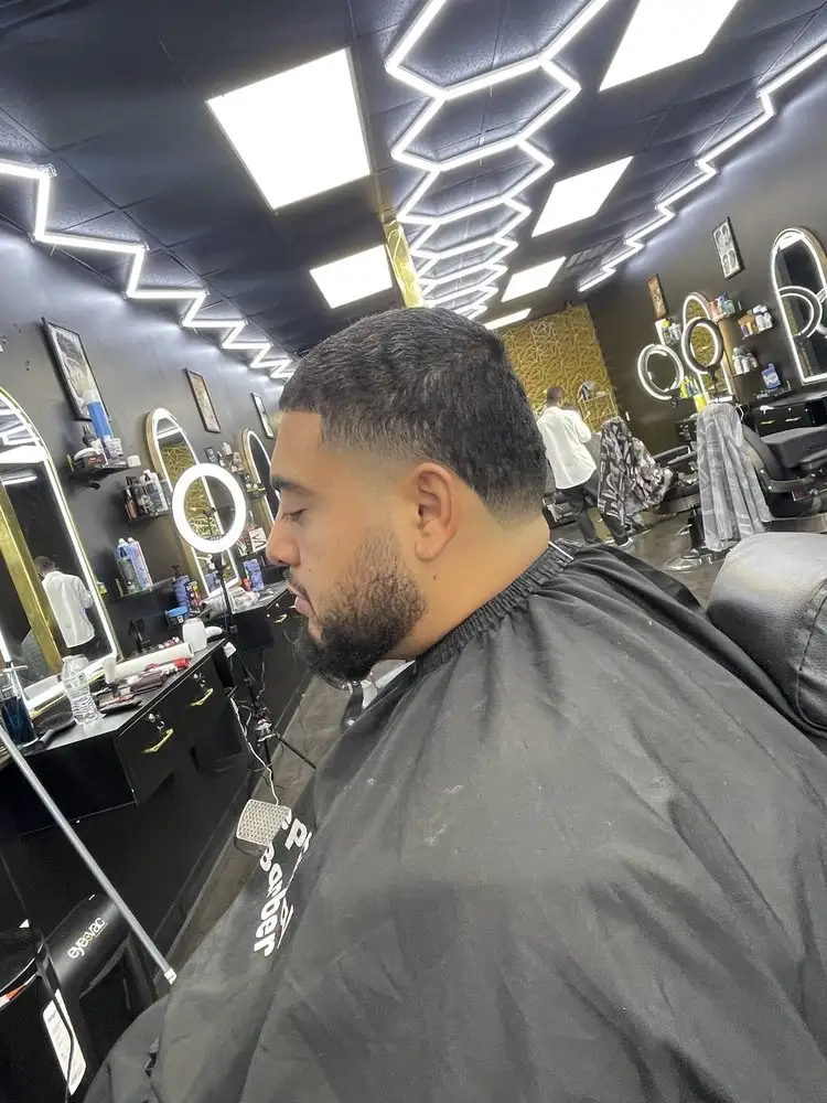 A fade and beard trim, side view
