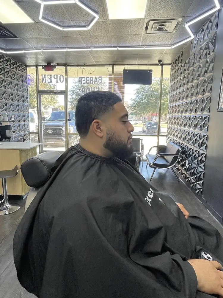 A low cut with a full beard, side view